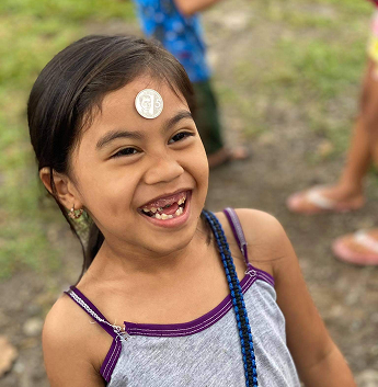Smiling child during outreach